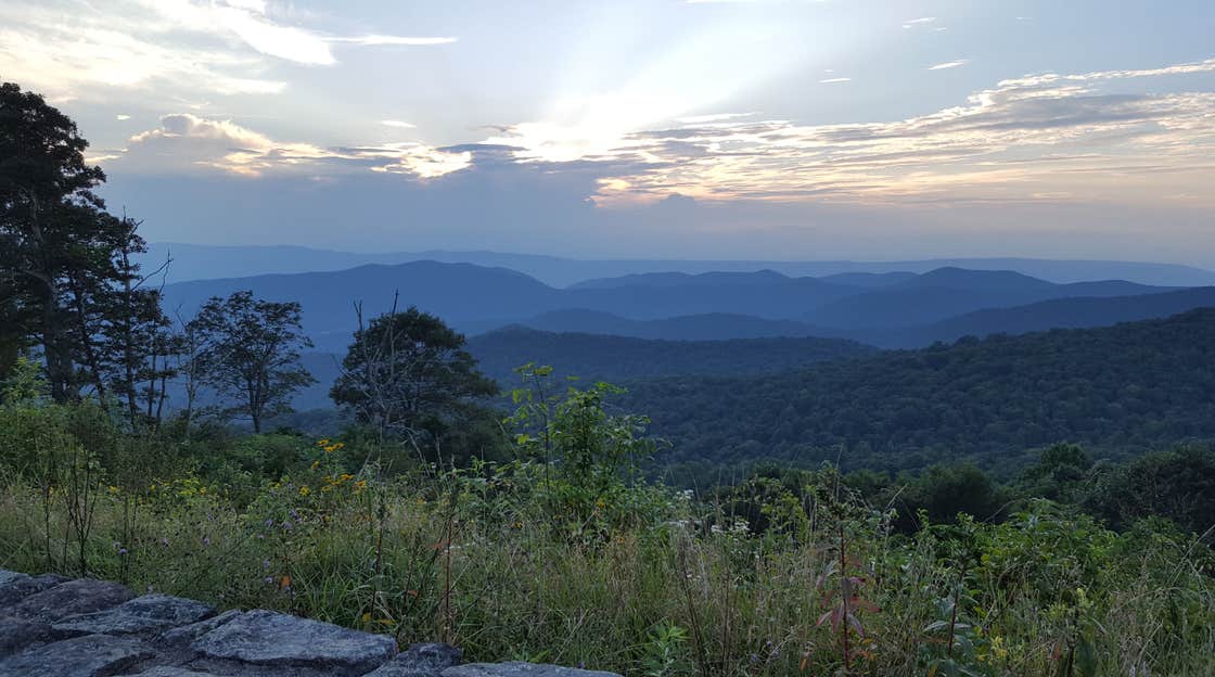 sun rays peering through the clouds over big meadows