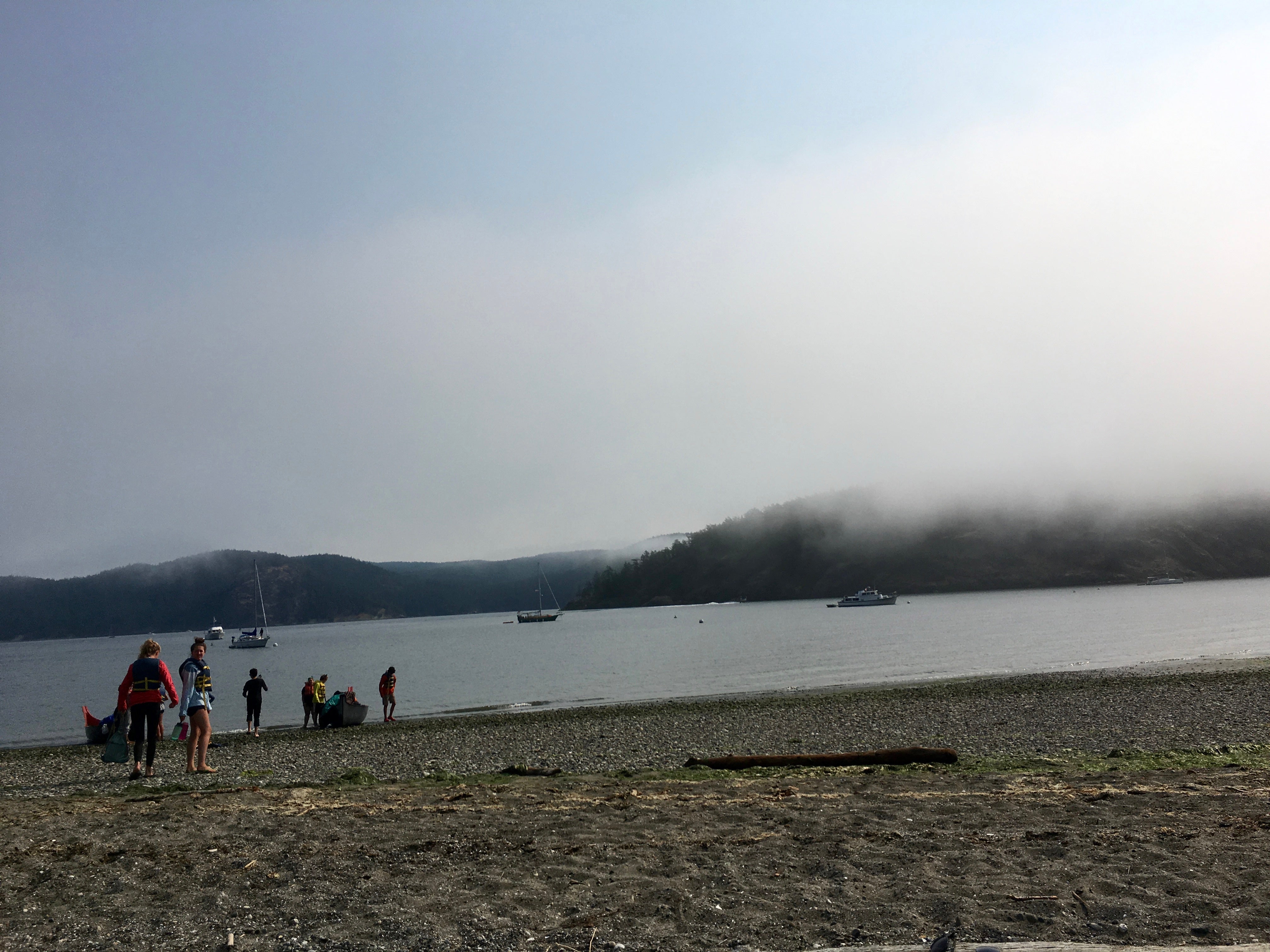Fog lifting off the spit, Orcas in the background