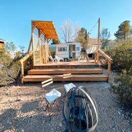 Campground Finder: Retro Camper with Desert Mountain View