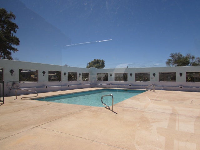 Pool with exterior wall & windows