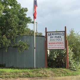 The Armadillo RV Park sign near the entrance