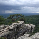 The top of hanging rock looking towards Winston Salem at a storm