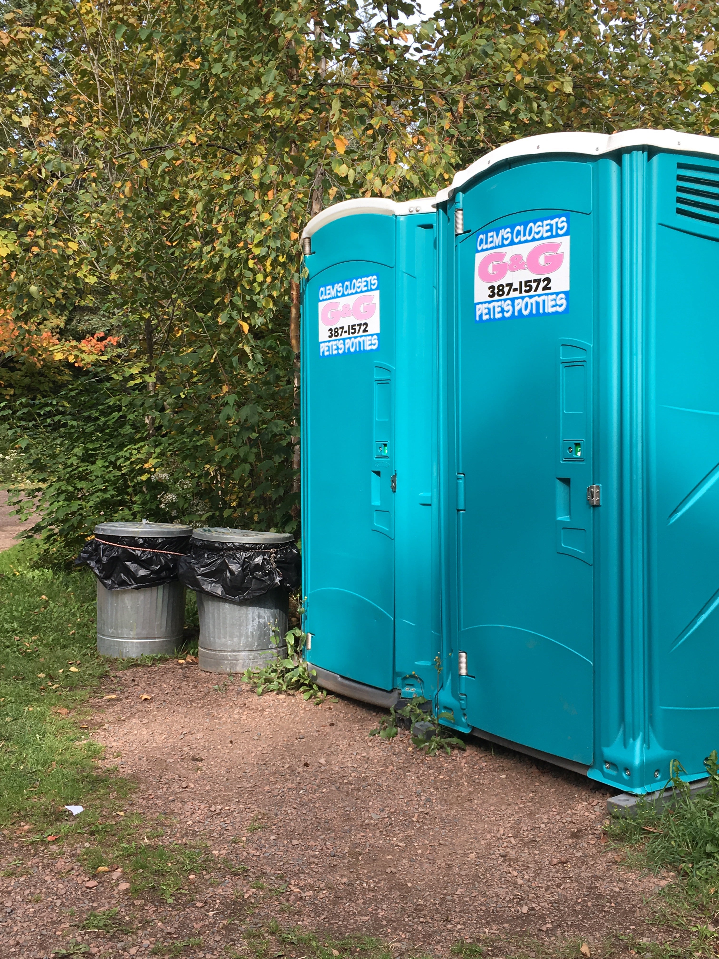 porta potties are closest, regular restrooms at bath house about 1/4 mile walk