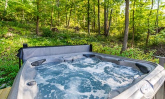 Camping near The Cove Campground: Hot Tub, Wraparound Deck, & WiFi at Chalet Cabin, Gerrardstown, West Virginia