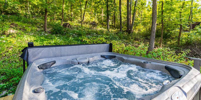 Camper submitted image from Hot Tub, Wraparound Deck, & WiFi at Chalet Cabin