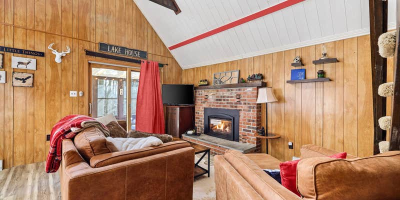 Camper submitted image from Hot Tub, Lake/Beach, Pools, & WiFi at Chalet Cabin