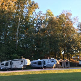 The showers are the small buildings to the right of the RVs