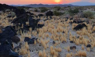 Camping near Silurian Dry Lake Bed: Indian Springs near lava field — Mojave National Preserve, Baker, California