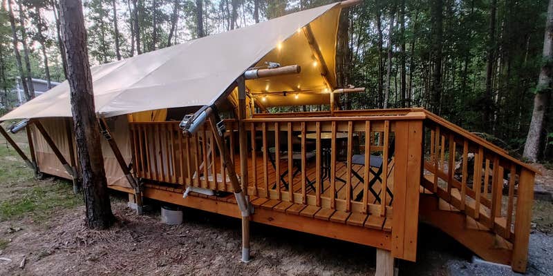 Camper submitted image from Glamping Tent with Covered Deck