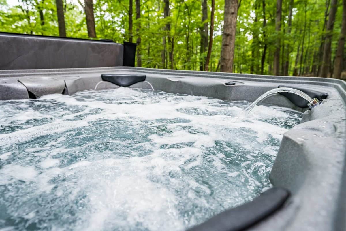Camper submitted image from Cozy Cottage w Hot Tub, Fire Pit, WiFi & Sunroom! - 1