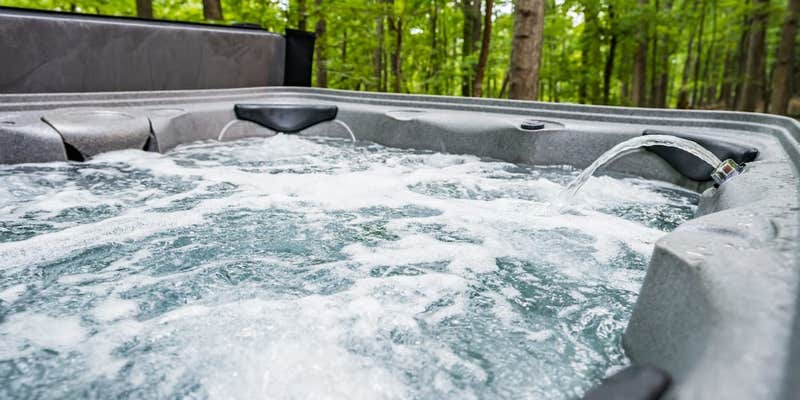 Camper submitted image from Cozy Cottage w Hot Tub, Fire Pit, WiFi & Sunroom!