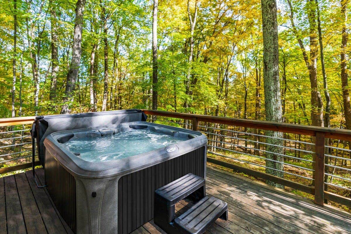 Camper submitted image from Hot Tub, Large Deck, Grill, WiFi, Resort Amenities - 2