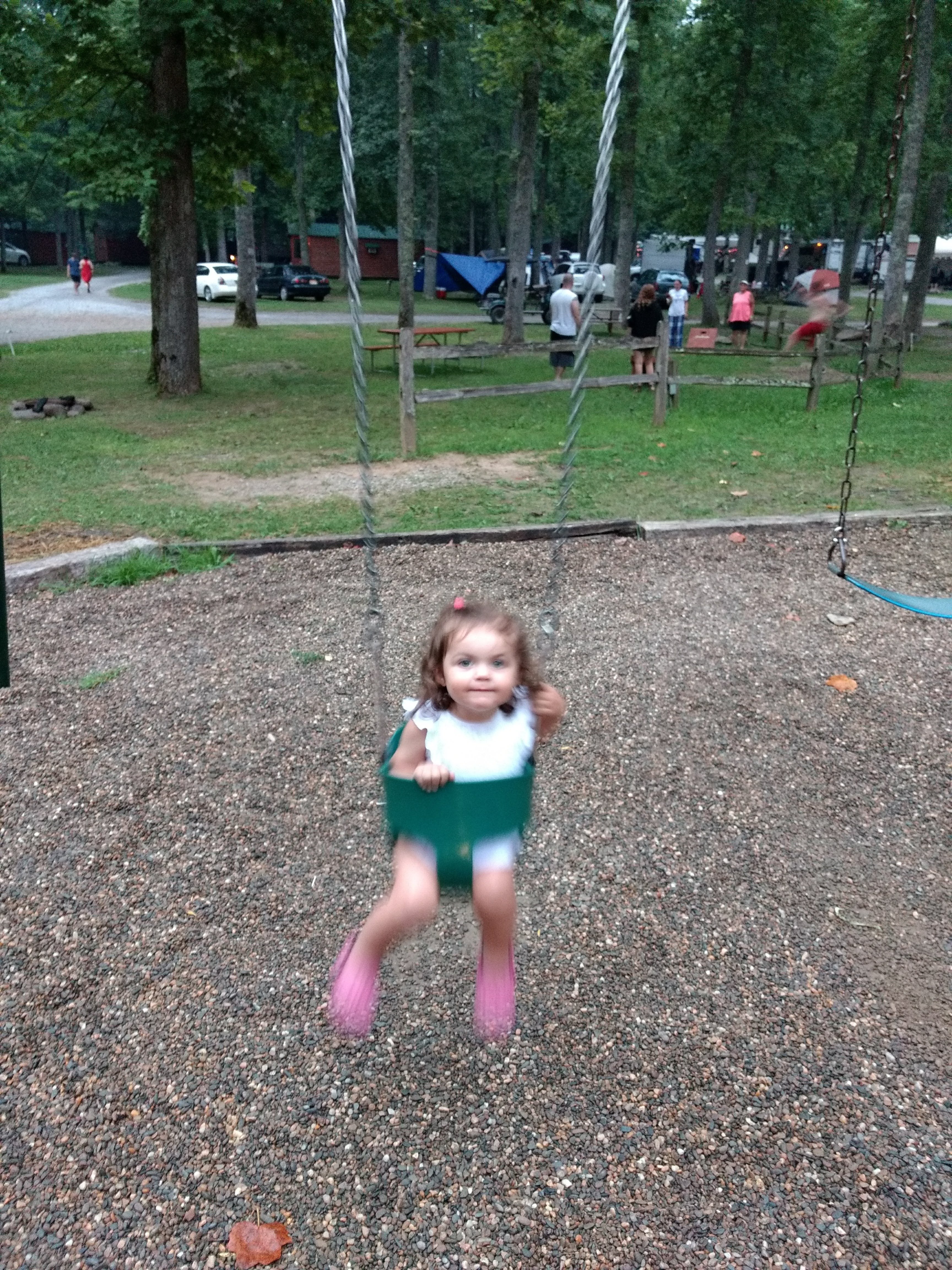 The playground had swings for babies and big kids.