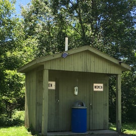 The vault toilet near the tent sites