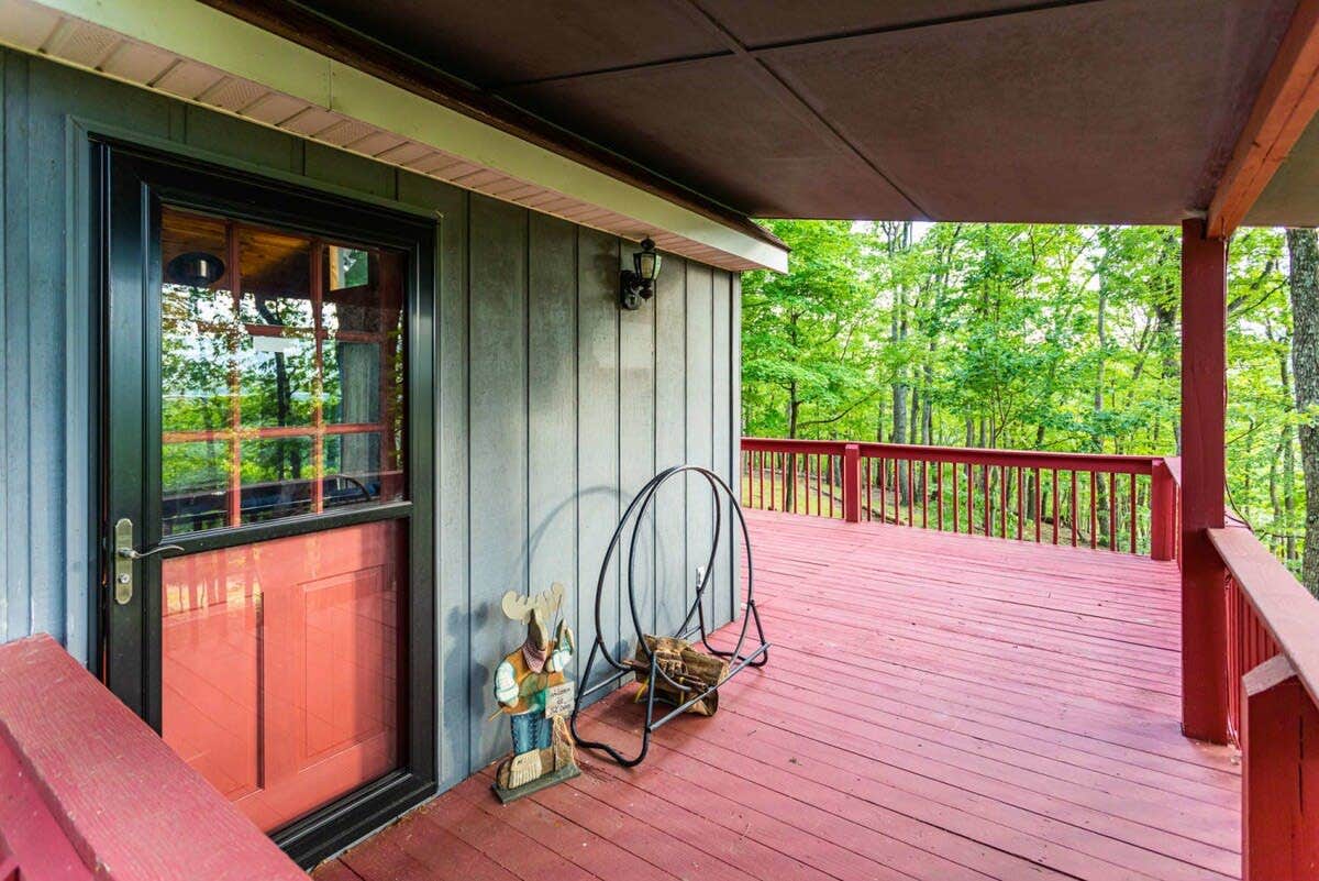 Camper submitted image from Hot Tub, Large Deck, WiFi, Fire Pit at Chalet Cabin - 1
