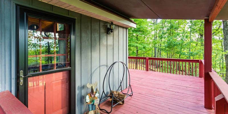 Camper submitted image from Hot Tub, Large Deck, WiFi, Fire Pit at Chalet Cabin