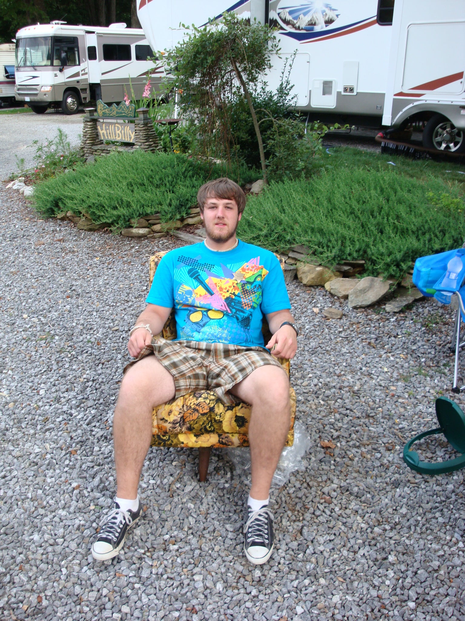 My son is relaxing in his easy chair at the campground.
