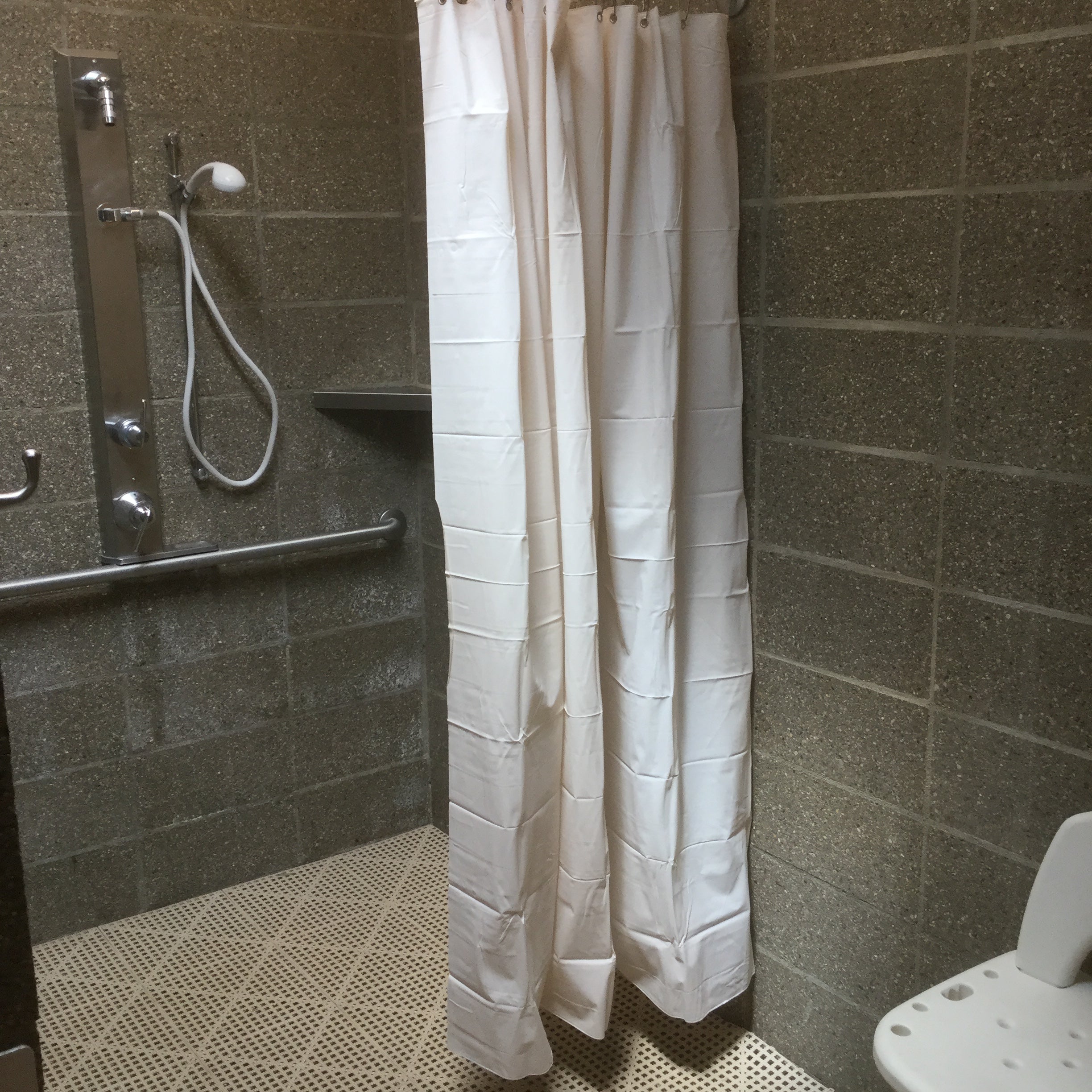 Handicap accessible bathrooms and shower with shower stools