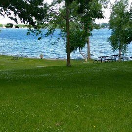 picnic tables along the lake