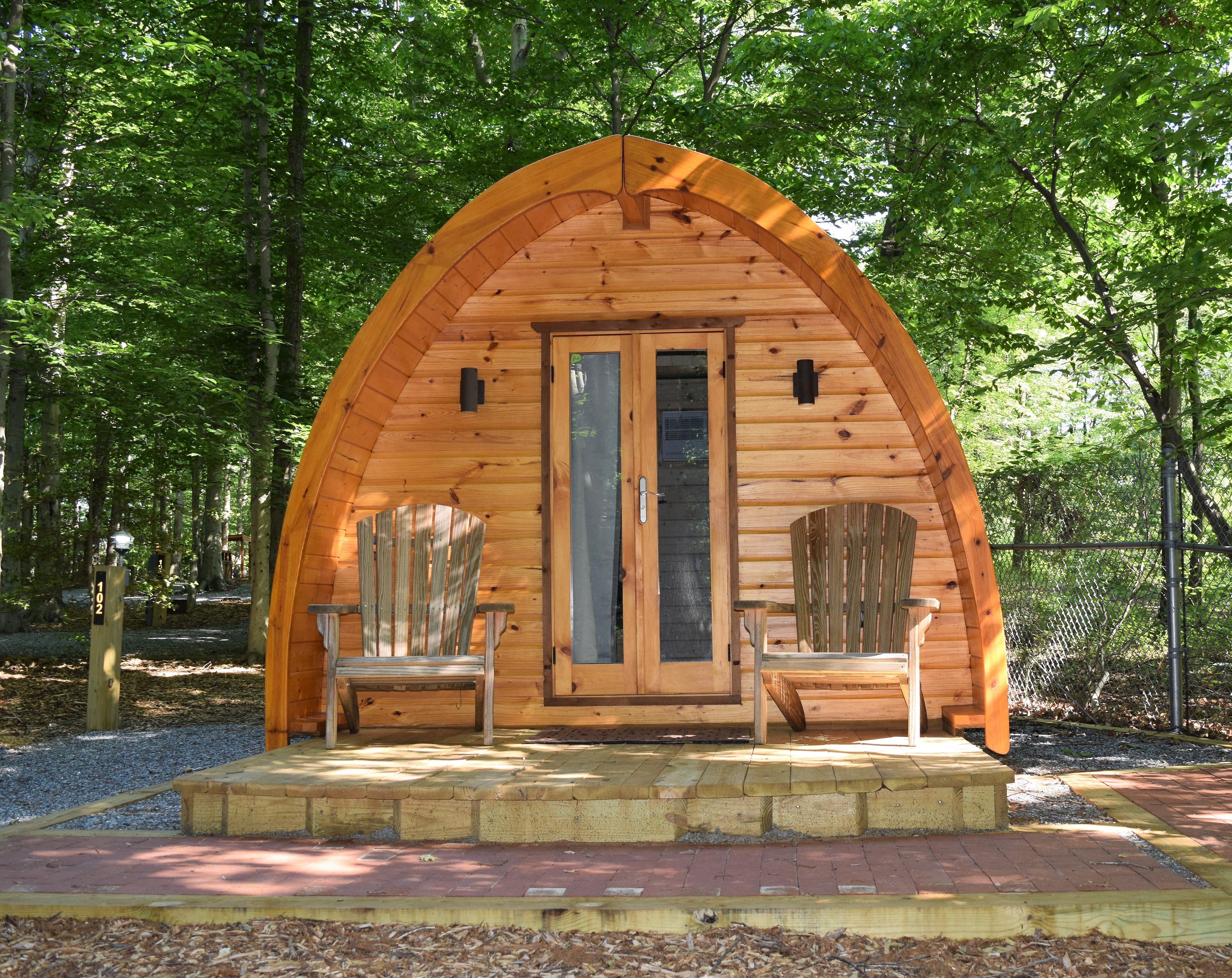 These quirky glamping pods sleep up to 4 people, with electricity and A/C.
