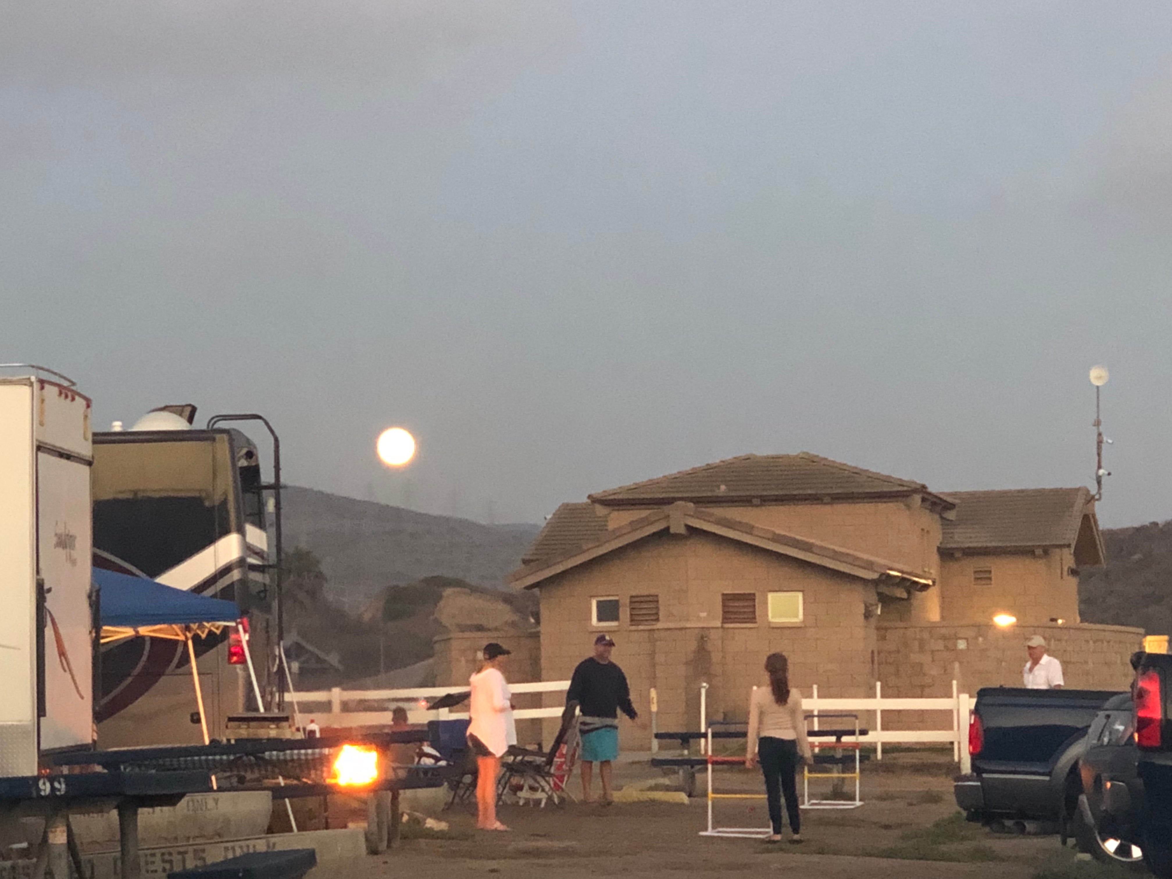 Cool moon with the bath house in the background.