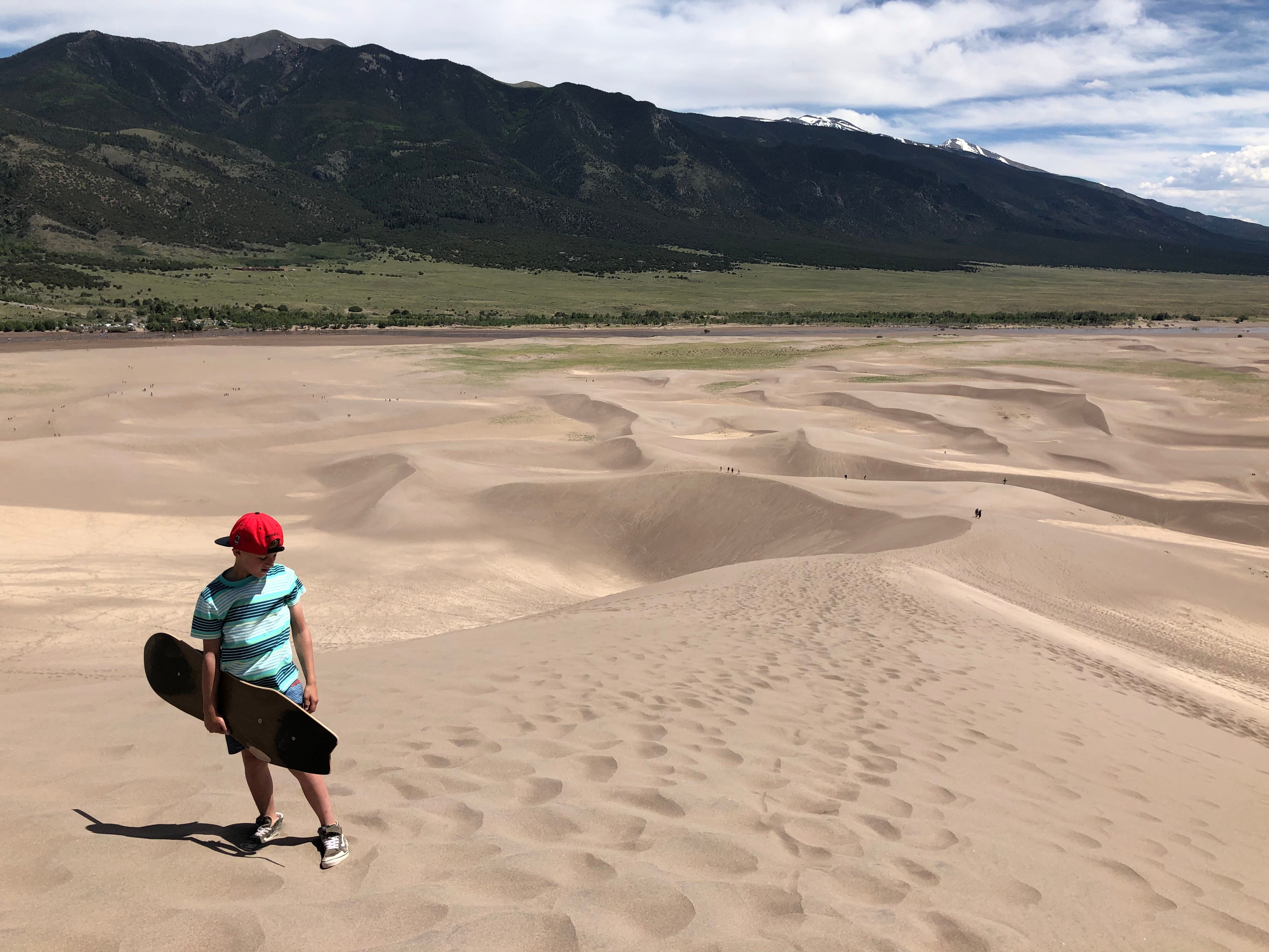 Sand boarding at Great Sand Dunes NP