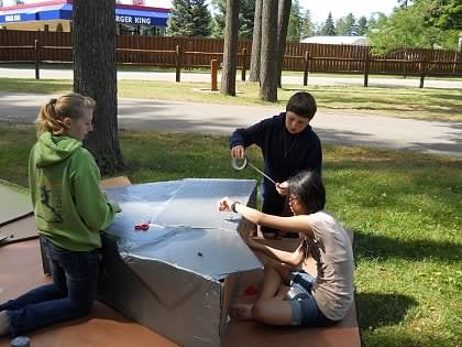 Putting together the Cardboard Boat.