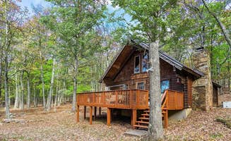 The Dyrt's photo of a cabin at Log Cabin w Loft, Hot Tub, Deck, Fire Pit, & WiFi near Great Cacapon, WV