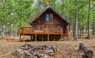 The Dyrt's photo of a cabin at Log Cabin w Loft, Hot Tub, Deck, Fire Pit, & WiFi near Burlington, WV
