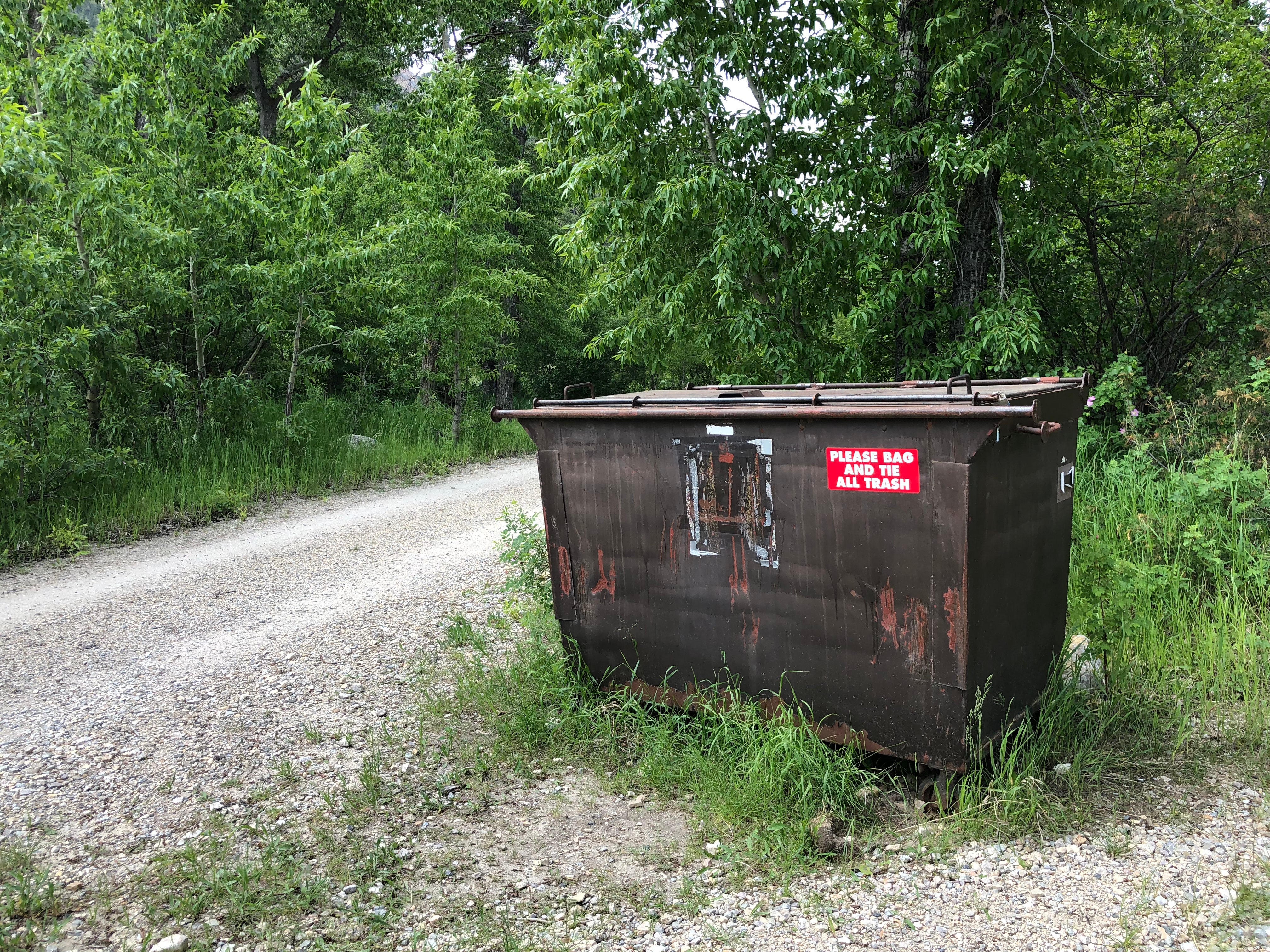 Garbage bin is on the hosts side of the creek