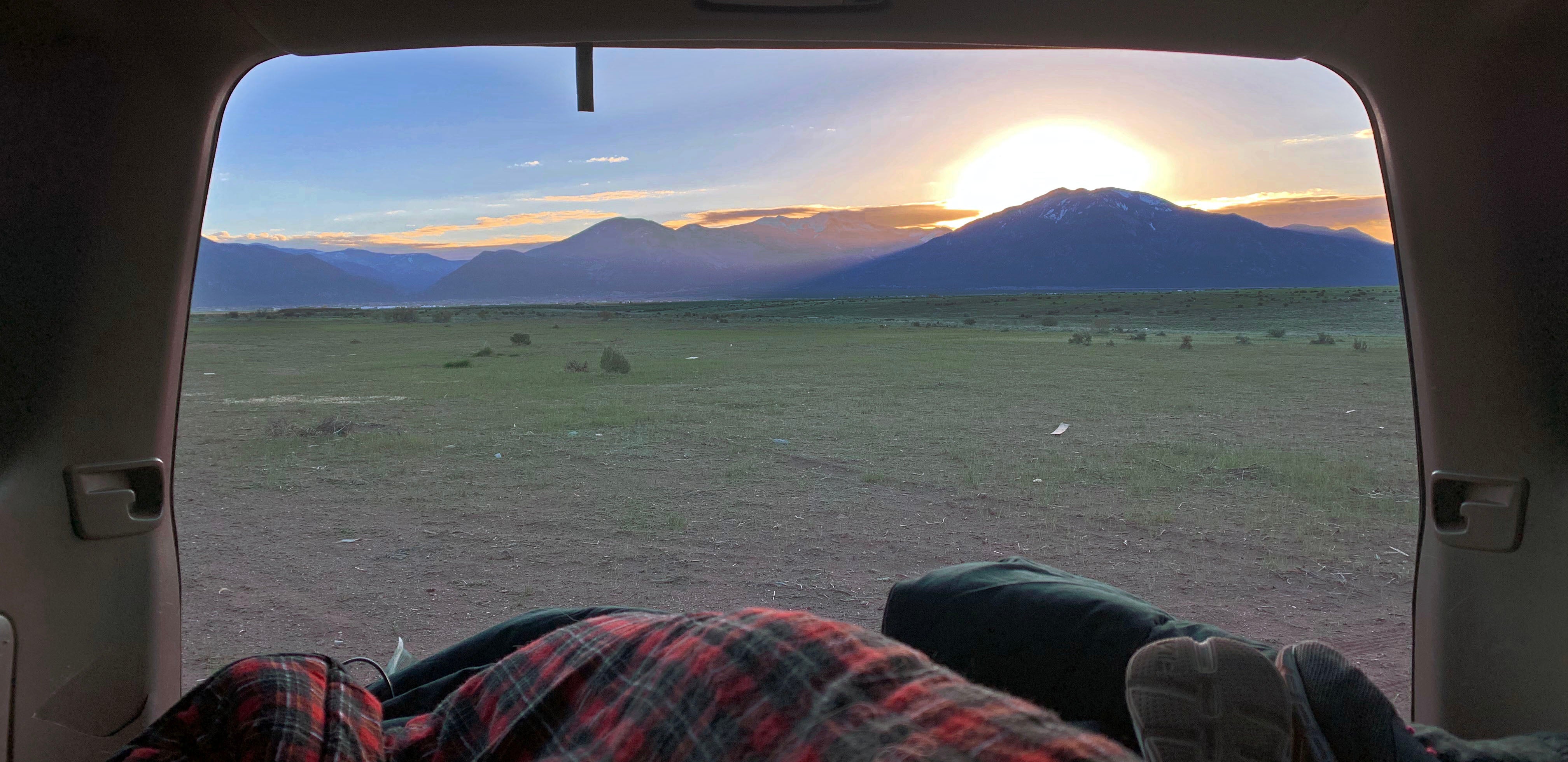 View from car camping in open area behind trailers