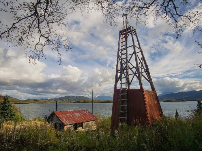 View of a wood cabin and windmill in a grassy field with a lake and mountains in the background.



Fure's Cabin and windmill, located in the Bay of Islands, Naknek Lake. Fure's Cabin is not a substitute for the Brooks Camp campground and is located a full day's paddle away.

Credit: NPS Photo
