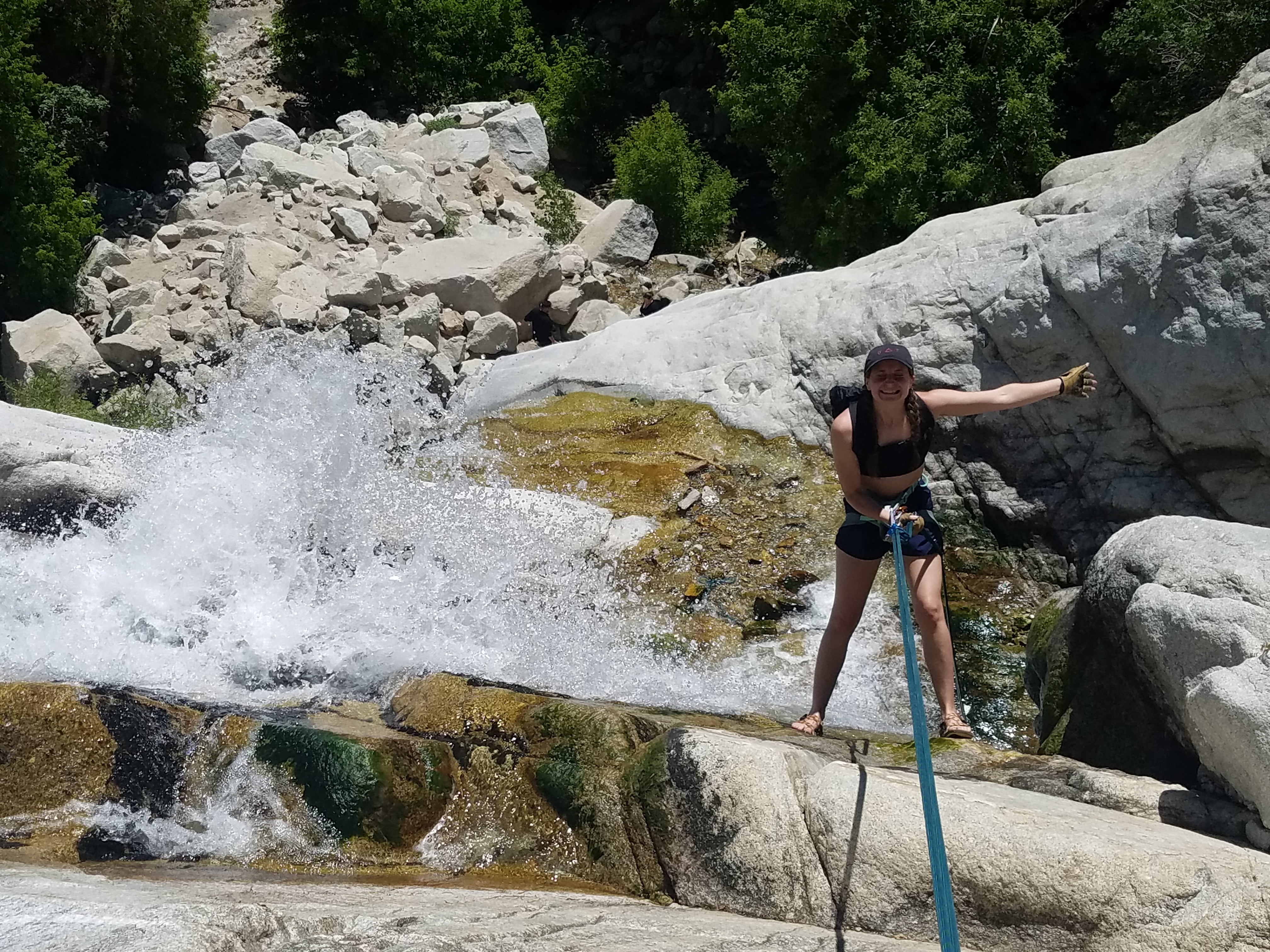 Shilah rappelling into the first pool of Lisa Falls!