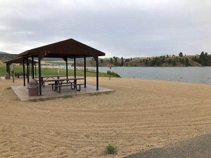 BLM White Sandy Campground beach area on Hauser Lake with paved parking for day-users. Sandy beach with 2 shade structures and picnic tables.



BLM Butte Field Office White Sandy Campground.

Credit: BLM
