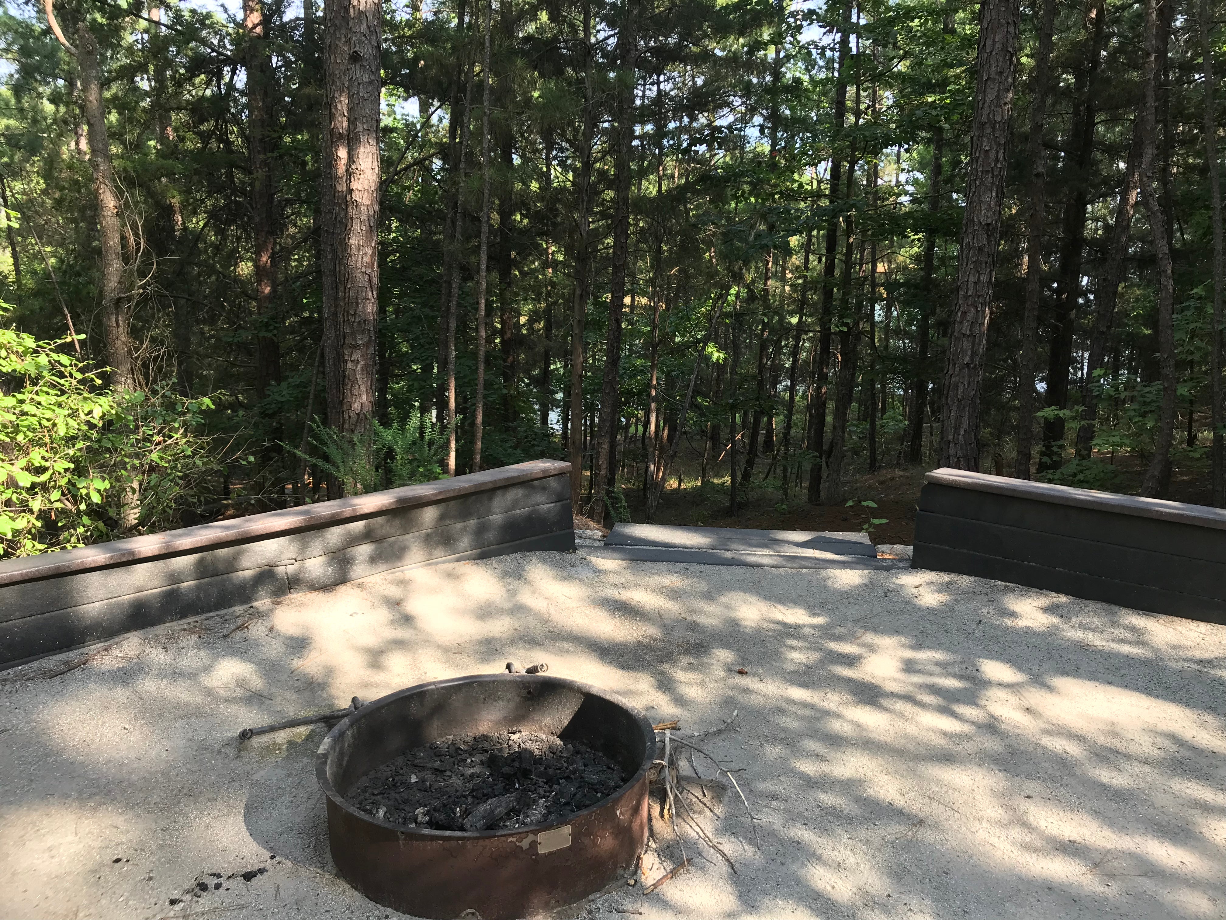 Behind the fire pit is the path to the lake