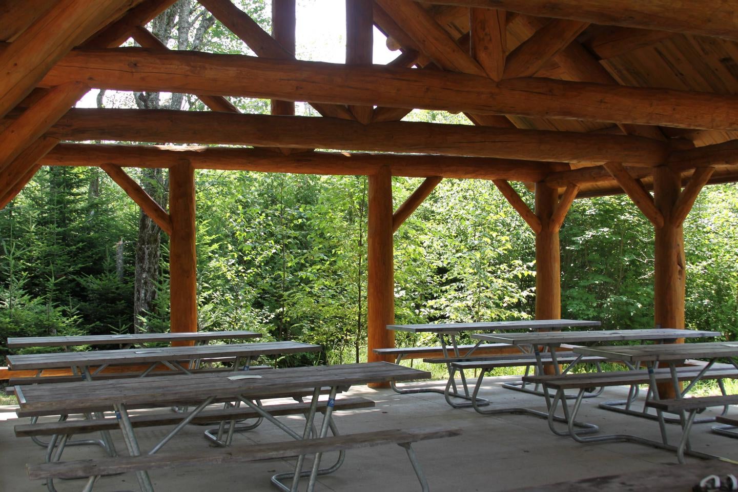 Interior view of log cabin style picnic pavilion with accessible picnic tables.



Pavilion for group campsites (Photo 2 of 2)

Credit: NPS