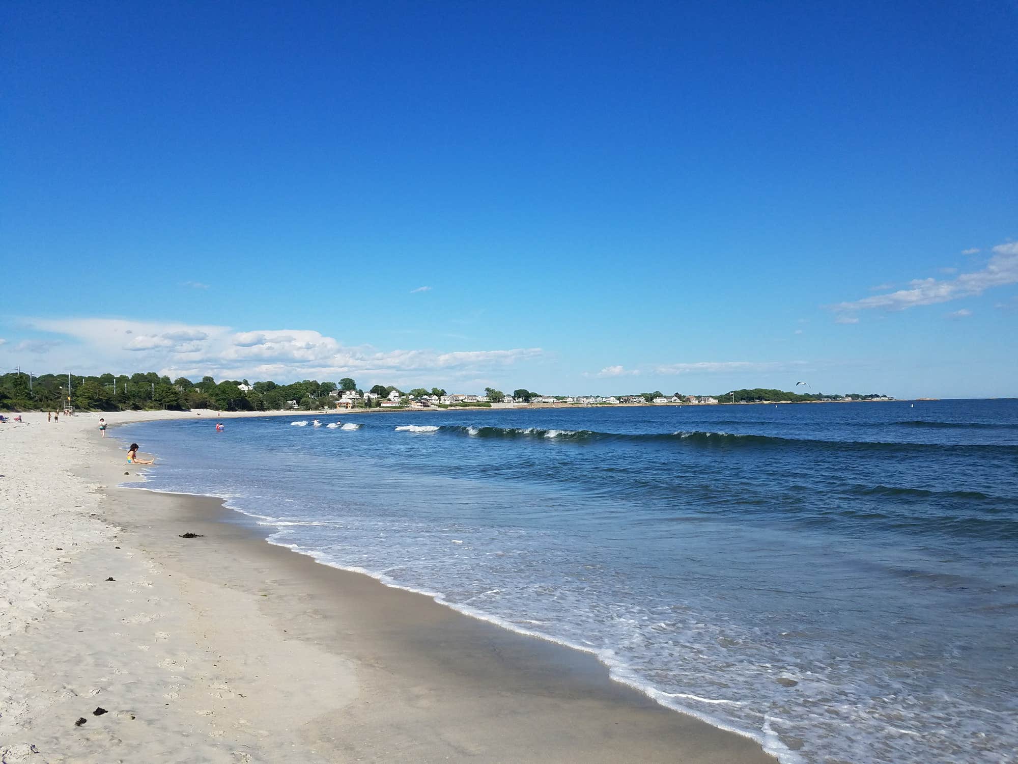 a connecticut beach on a clear, blue day