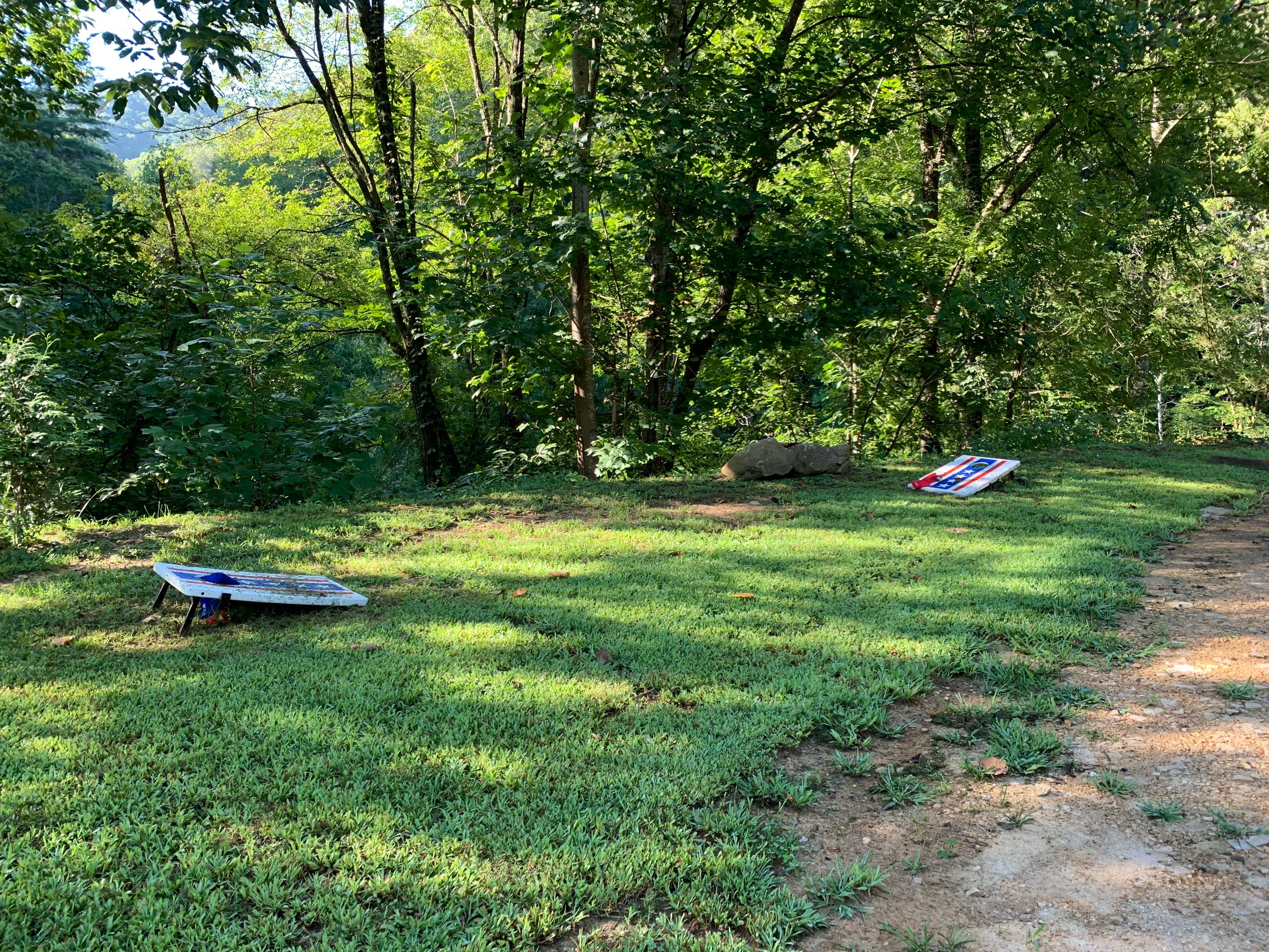 Corn hole and horse shoes by tents sites.