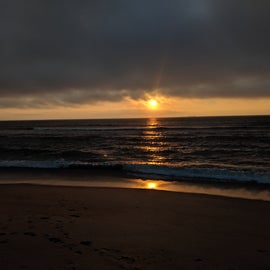 Sunset as viewed from a nearby beach area