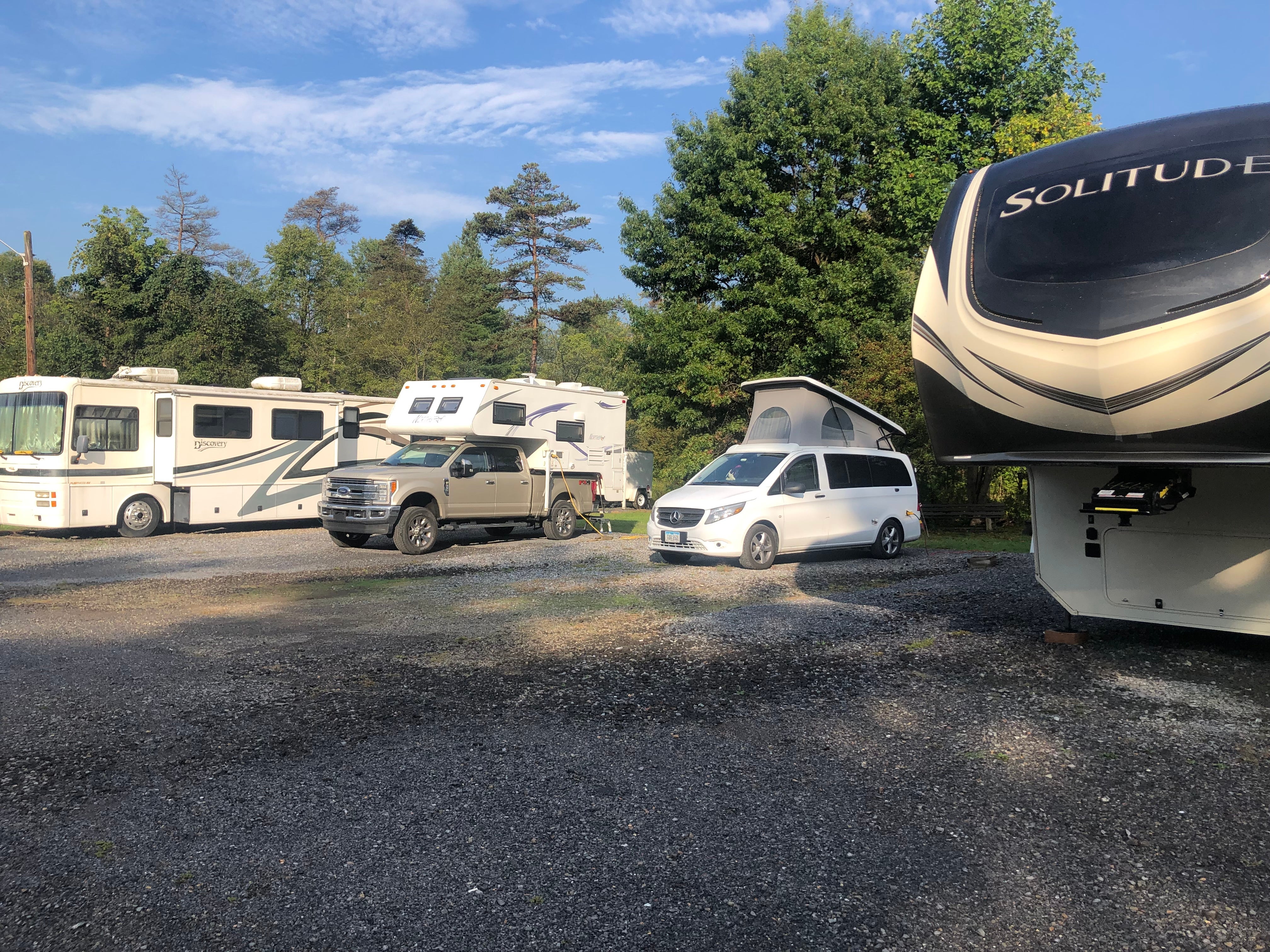 Our tiny van and the truck camper were dwarfed by all the large RVs