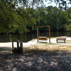 Lovely swinging bench by the river