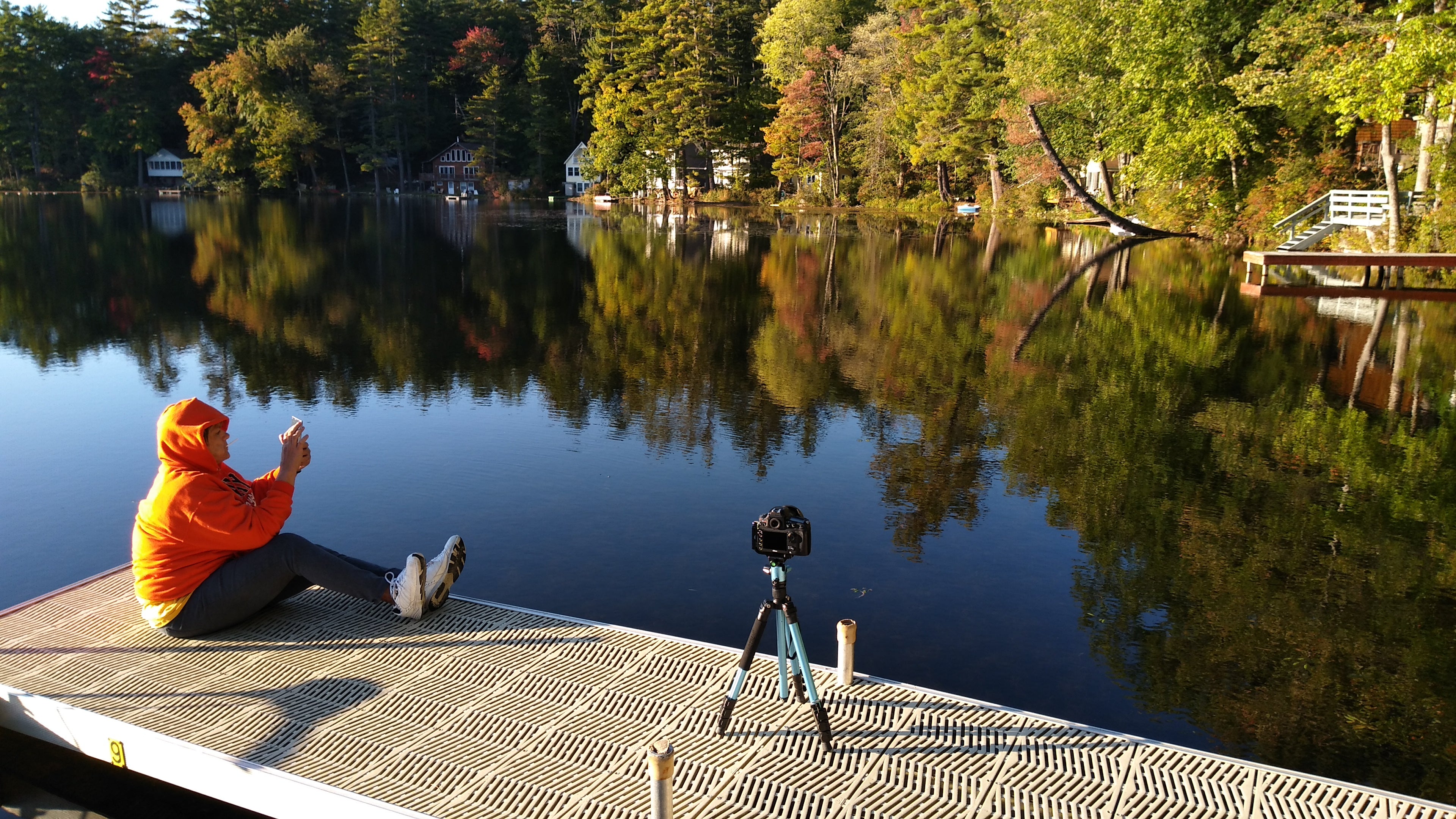 My wife sitting on the dock as I begin taking some foliage shots of the beautiful shoreline.