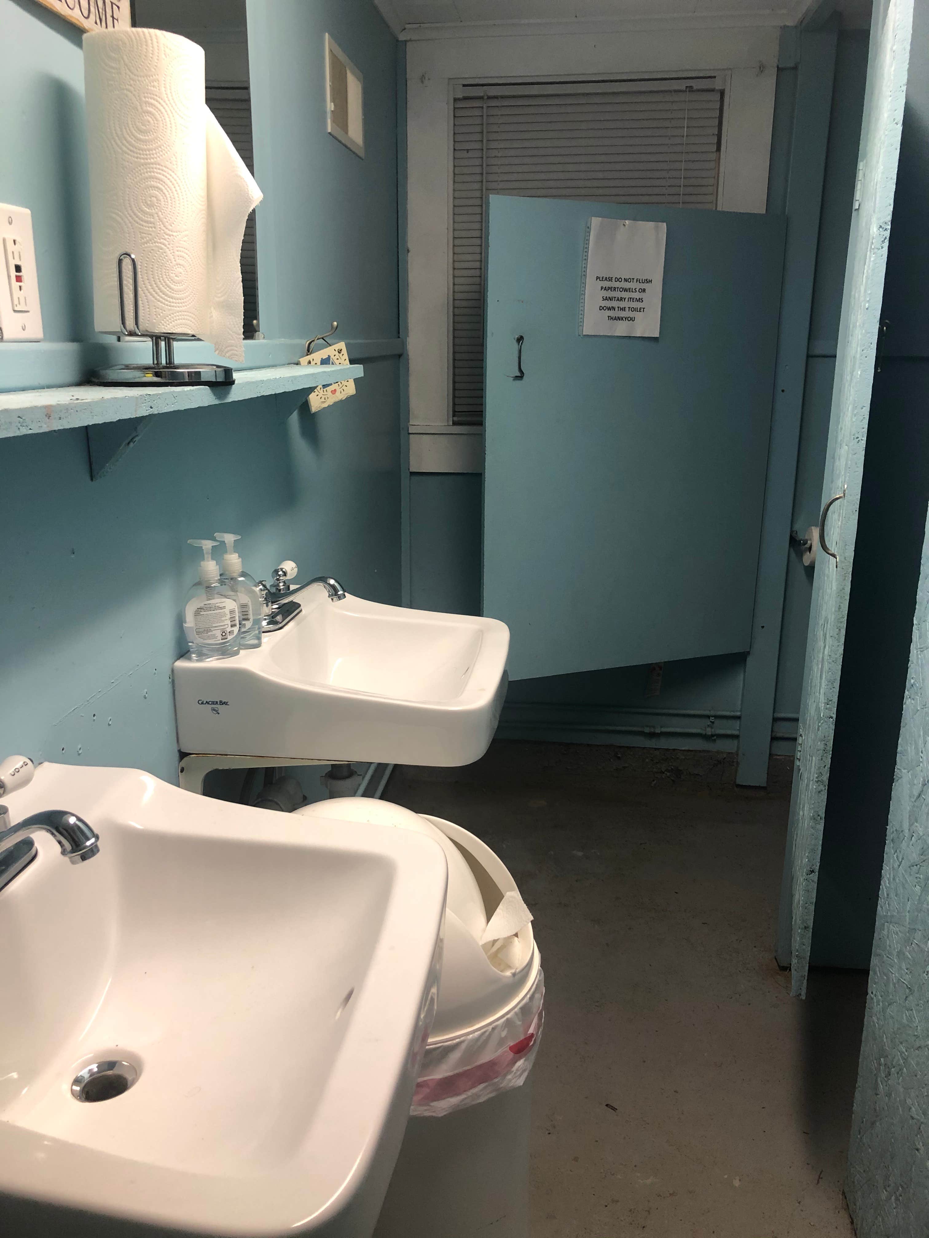Women's bathroom - two stalls plus one shower. Small but clean