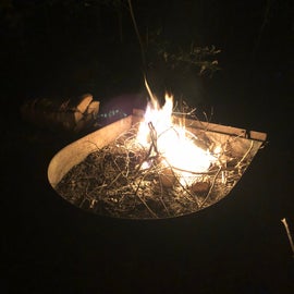 Enclosed fire ring with grill