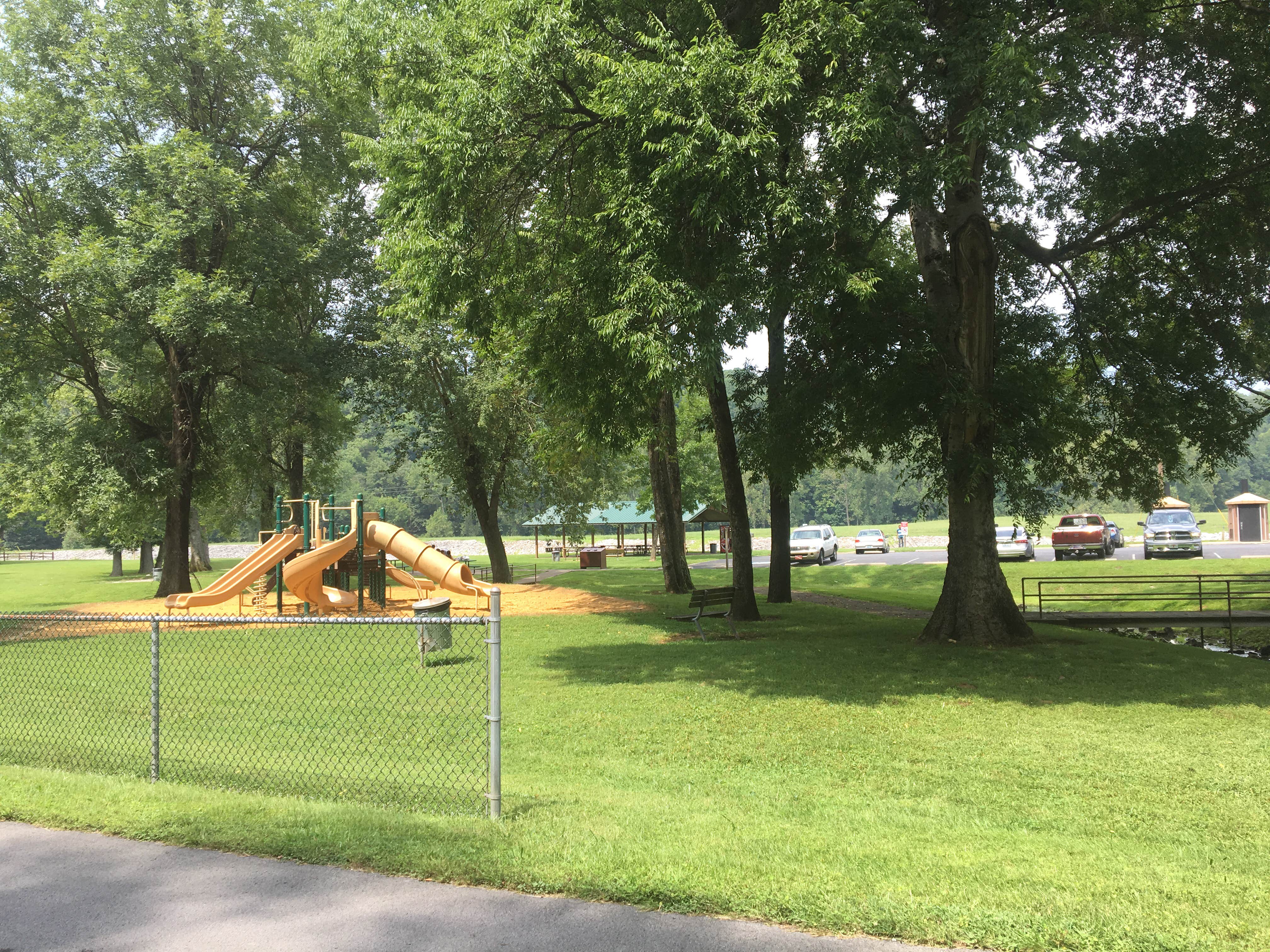 The playground with pavilion in the background 