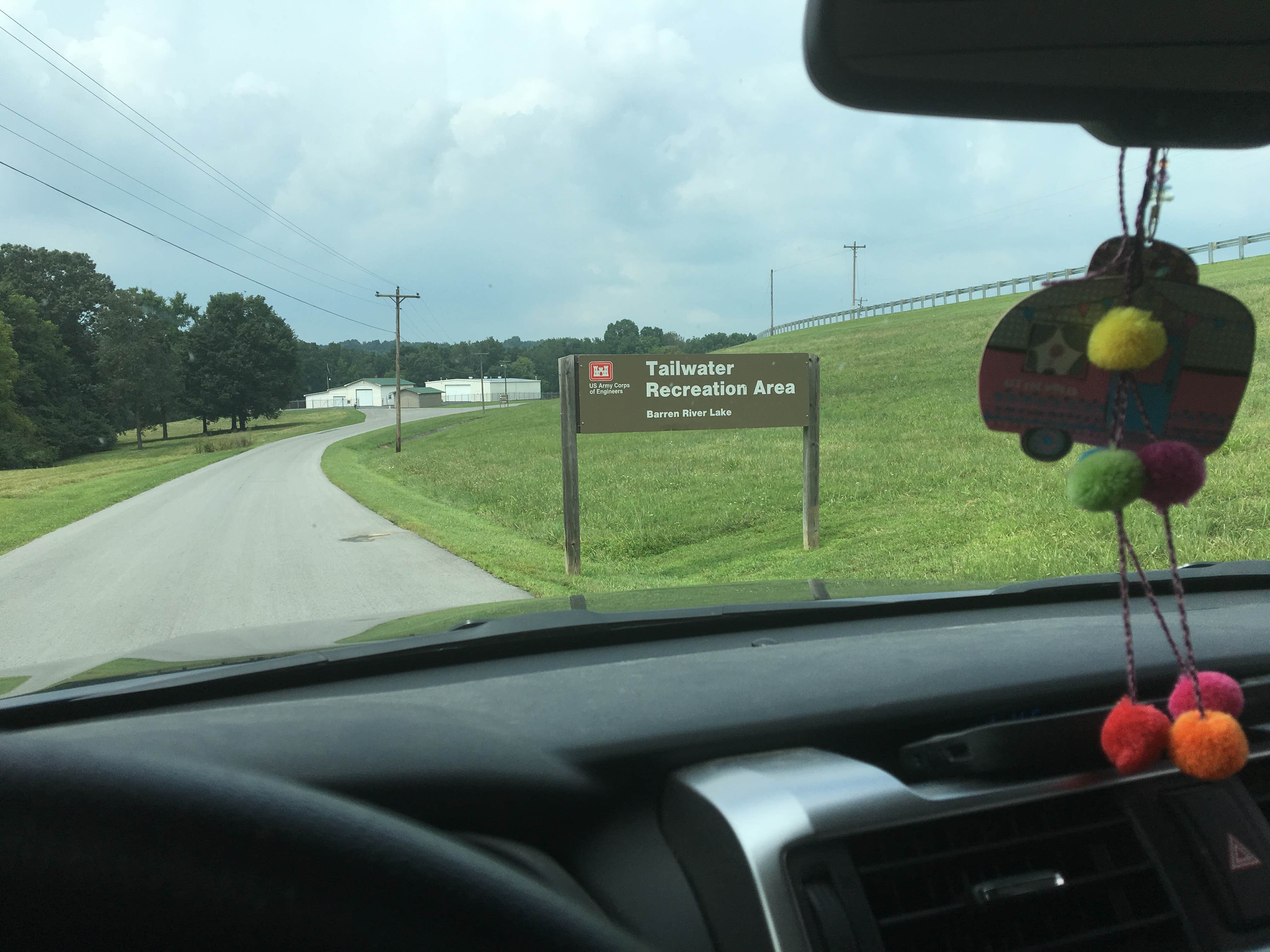 The sign is right before (or after) you cross the dam. Port Oliver Recreation  is directly across from the entrance.
