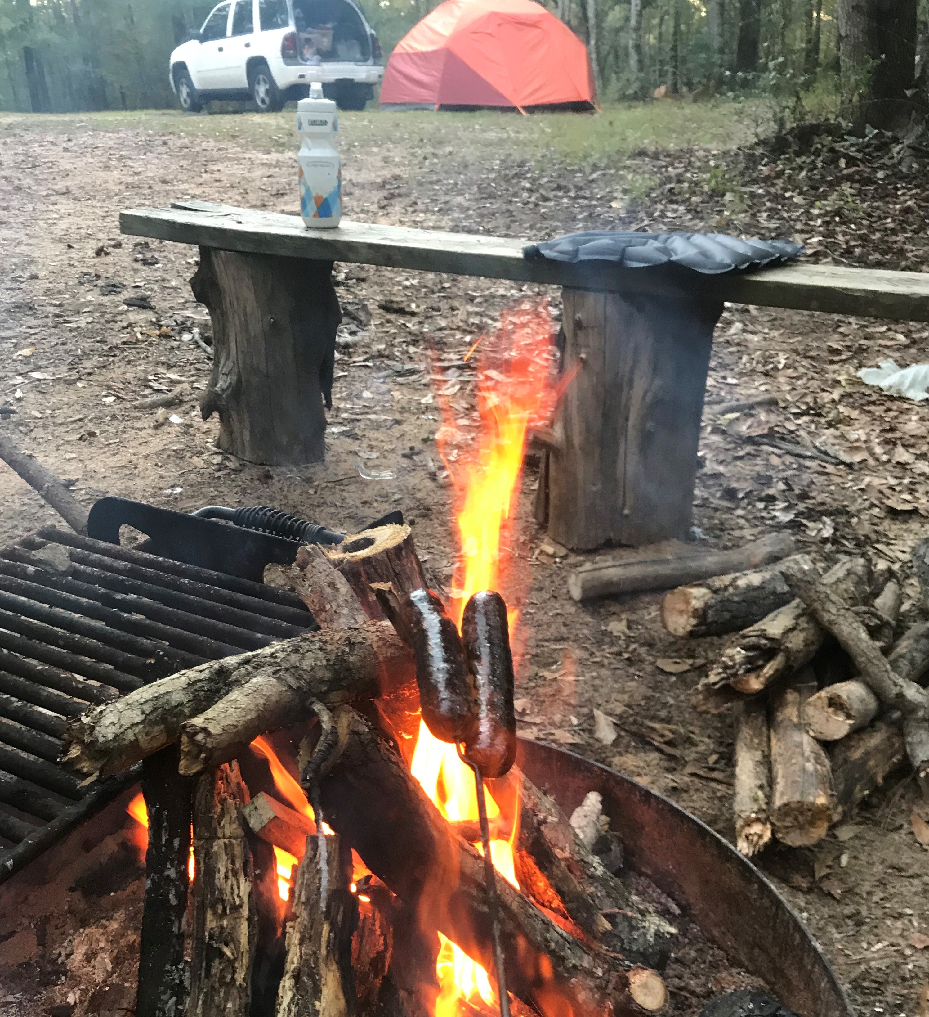 Obligatory campsite fire with tent in the background photo.