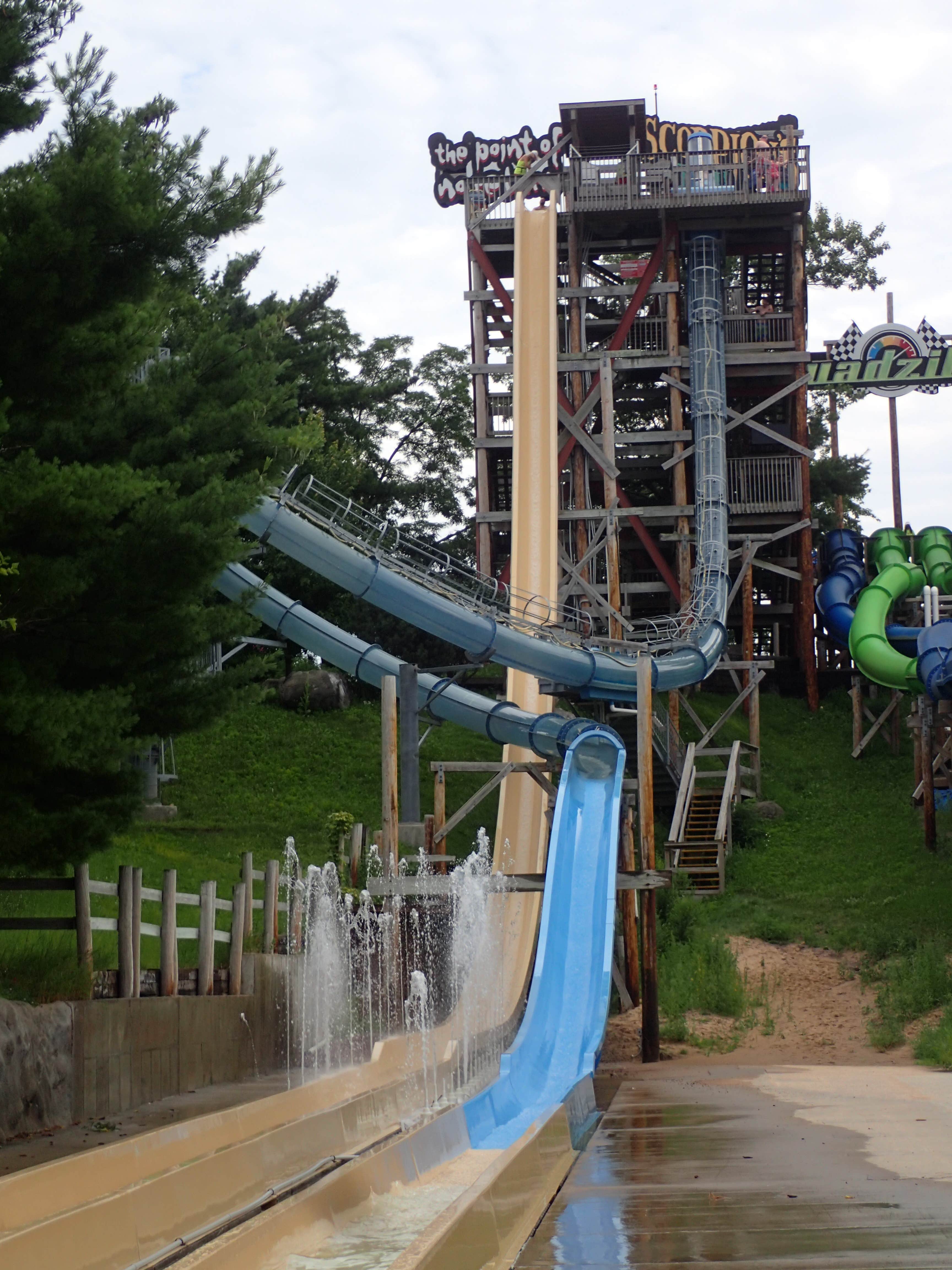 View of the top 2 'thrill' rides at Noah's Ark, which are right next to each other - there's the typical straight-down one, but then there's also the Scorpion's Tail, which goes straight down then actually LOOPS around and comes back down - keep in mind you're doing this on your back, no tube / raft