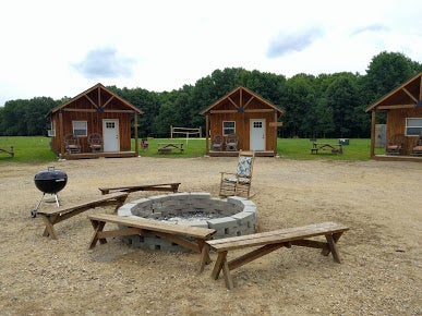 Family cabins and community fire-pit.