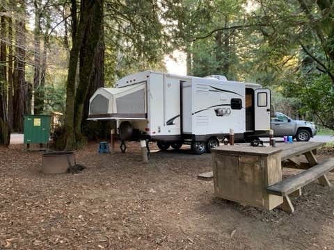 Campsite 4, trailer with truck parked sideways in front